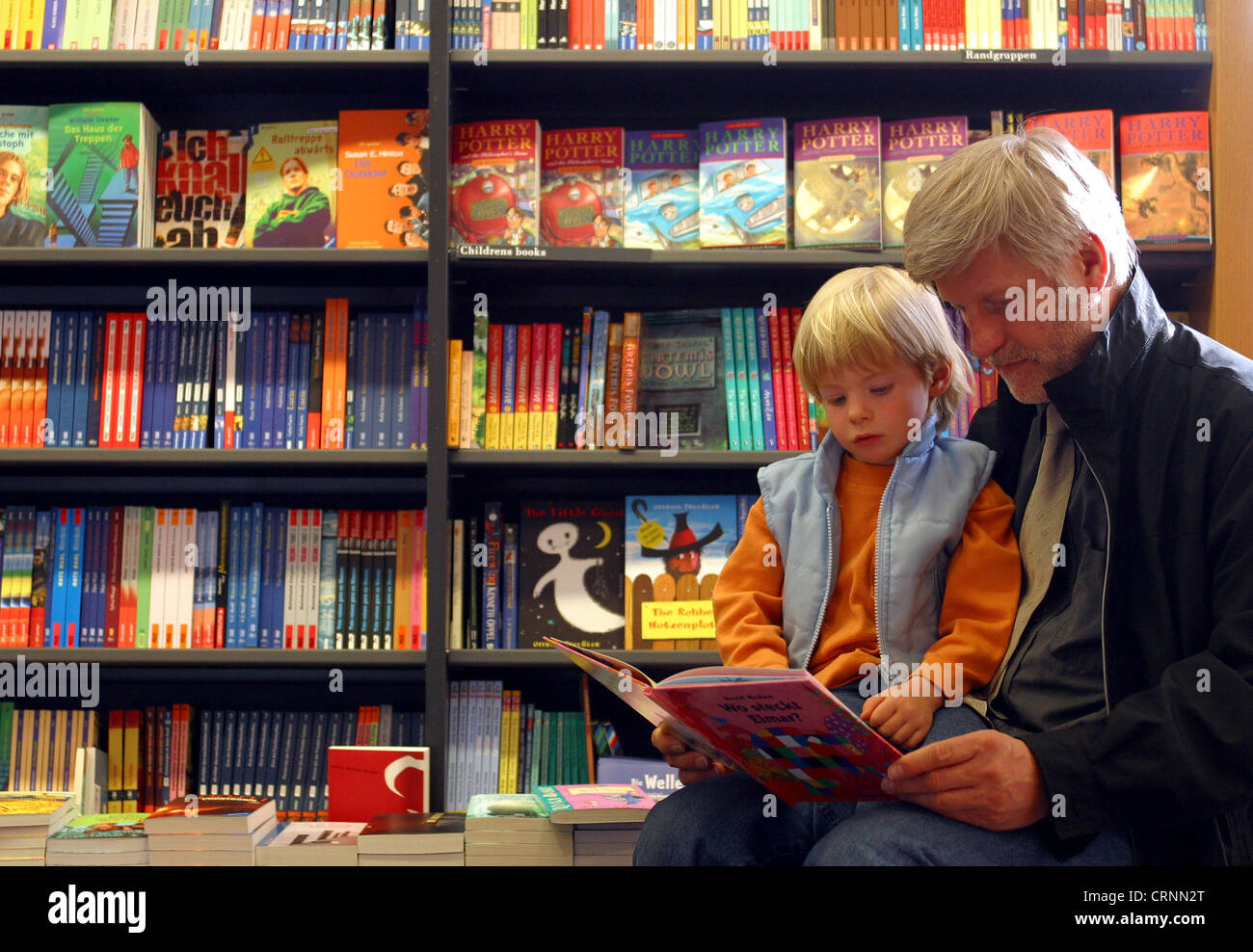 Father - Son - Reading - Bookstore in Food Stock Photo