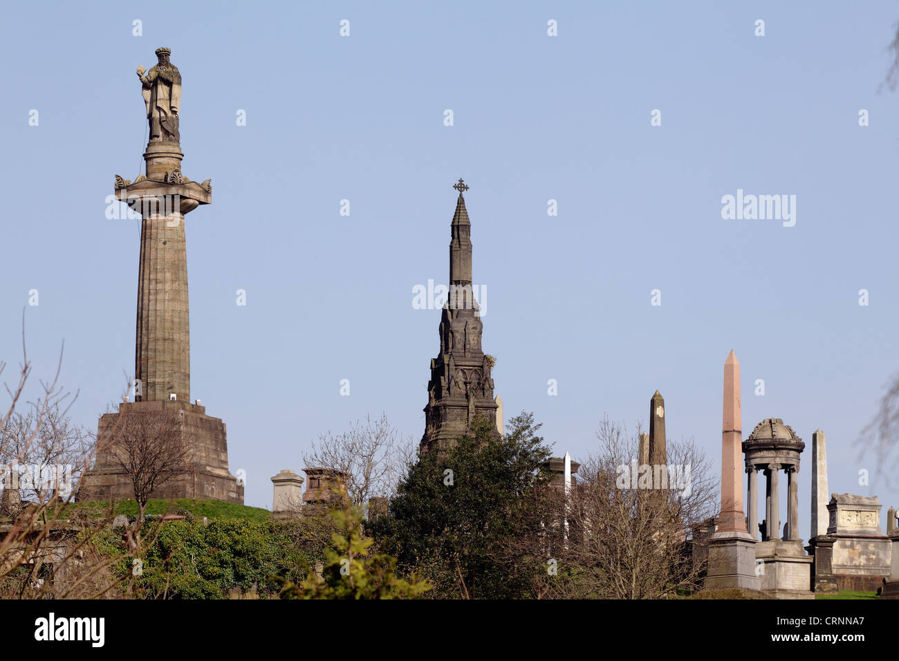 John Knox statue, on the left, Scottish Protestant Reformer, Glasgow Necropolis, Scotland, UK Stock Photo