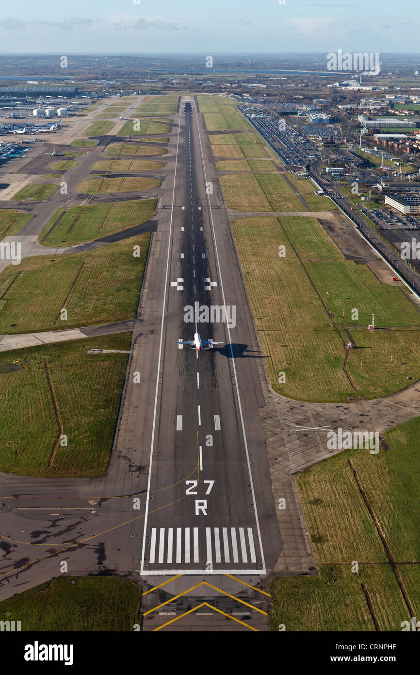 Aerial view of a British Airways Airbus landing on runway 27R at London Heathrow Airport. Stock Photo