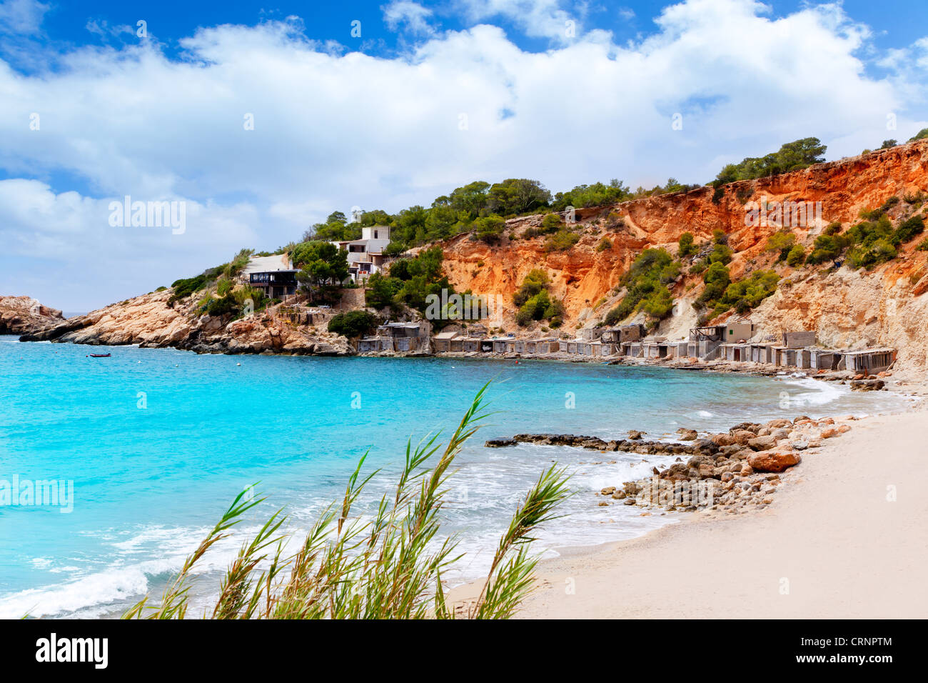 Cala d Hort Ibiza beach with traditional wood boat mooring in Balearic