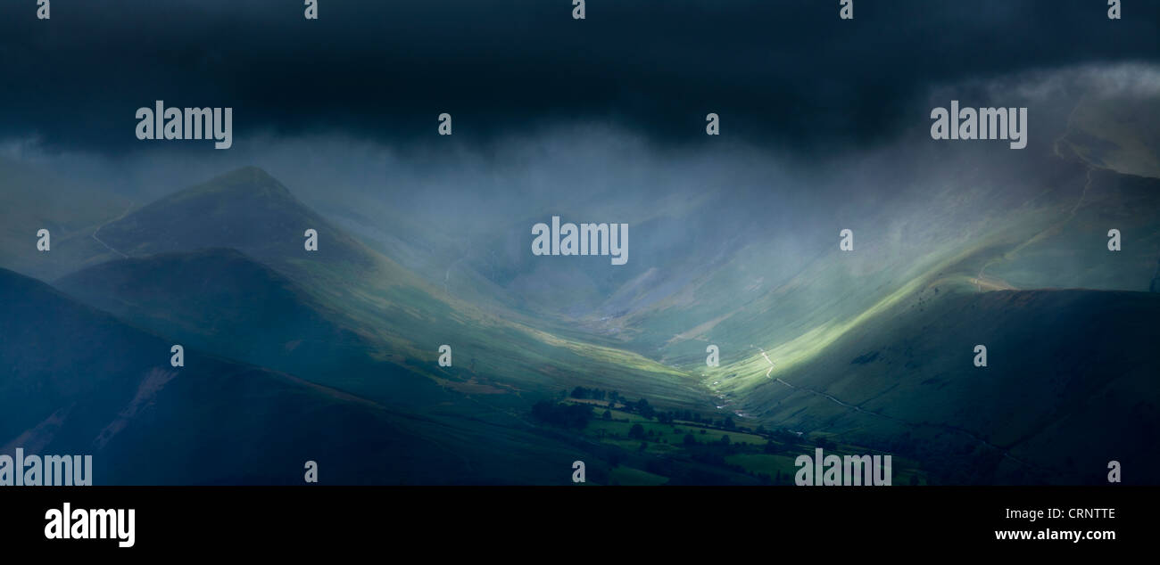 Breaking light through storm clouds above the Northern Fells near the ...