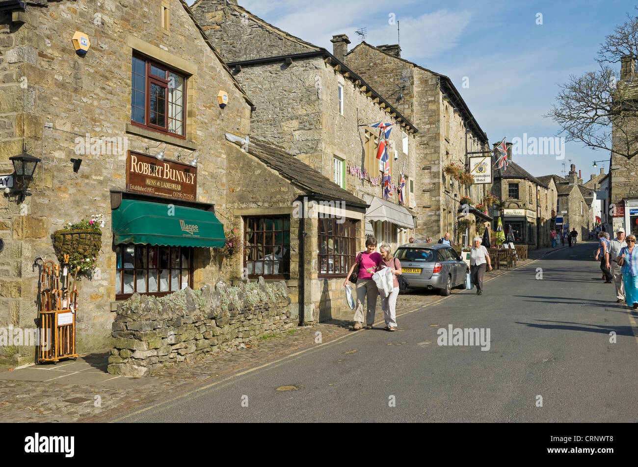 People walking through the small market town of Grassington, the main tourist centre in Upper Wharfedale. Stock Photo