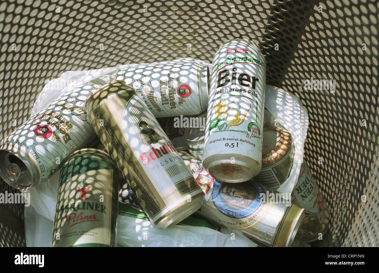 Beer cans of different brands in a trash can Stock Photo Alamy