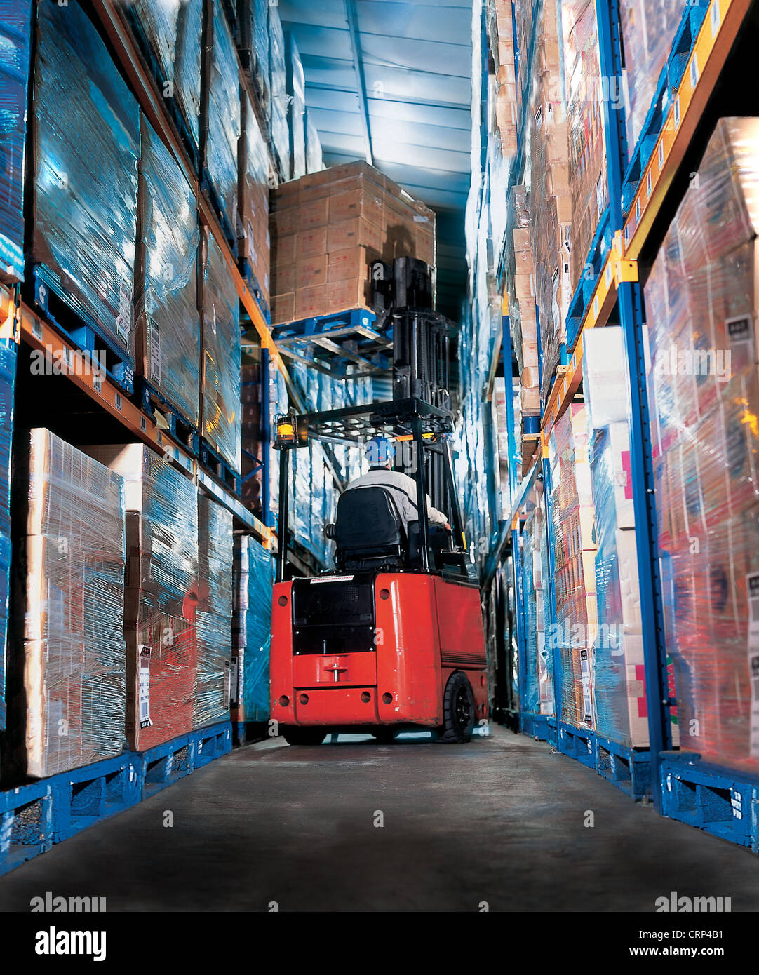 Warehouse unloading goods with forklift in distribution warehouse Stock ...