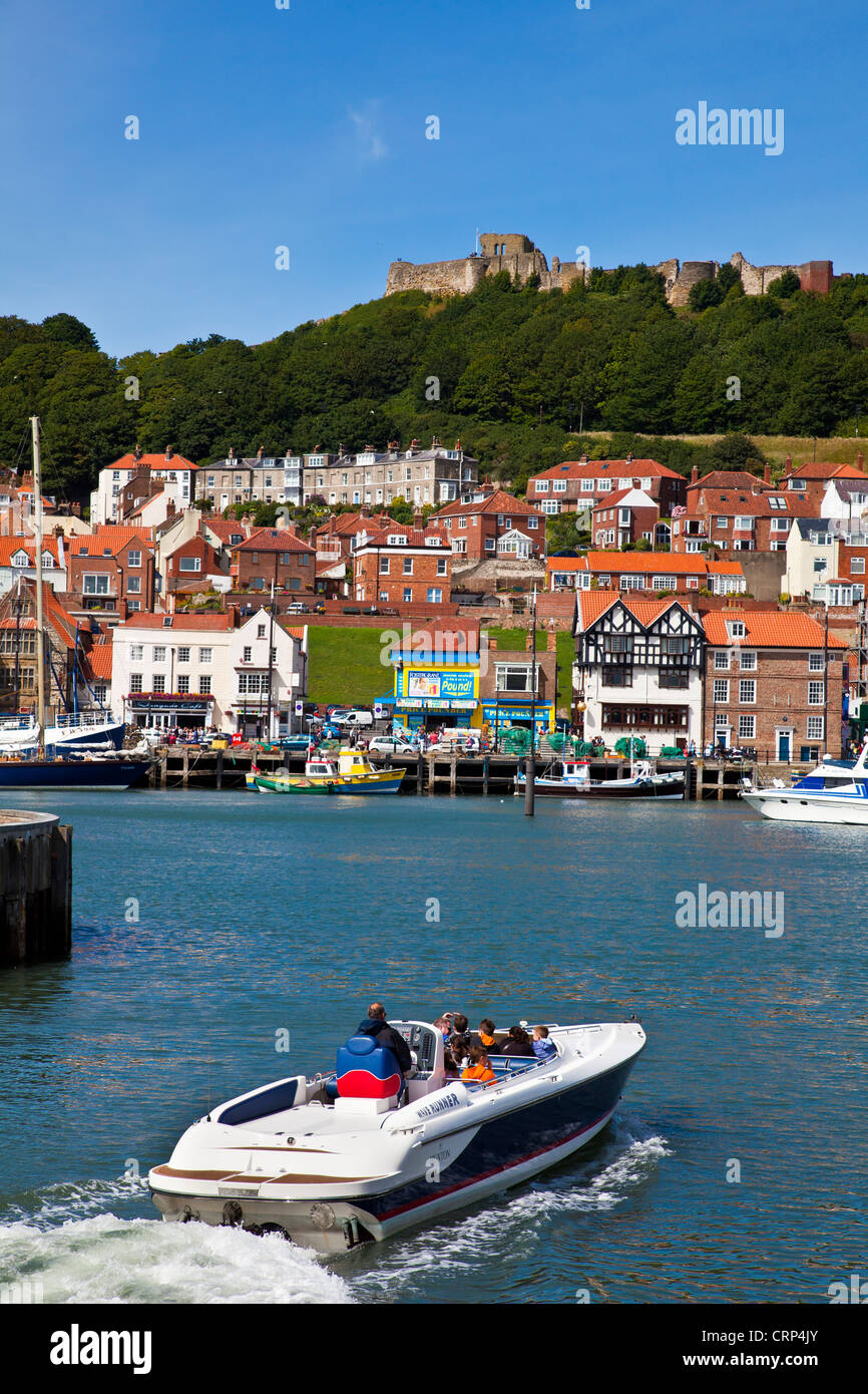 Tourists returning from a boat trip to Scarborough Harbour. Stock Photo