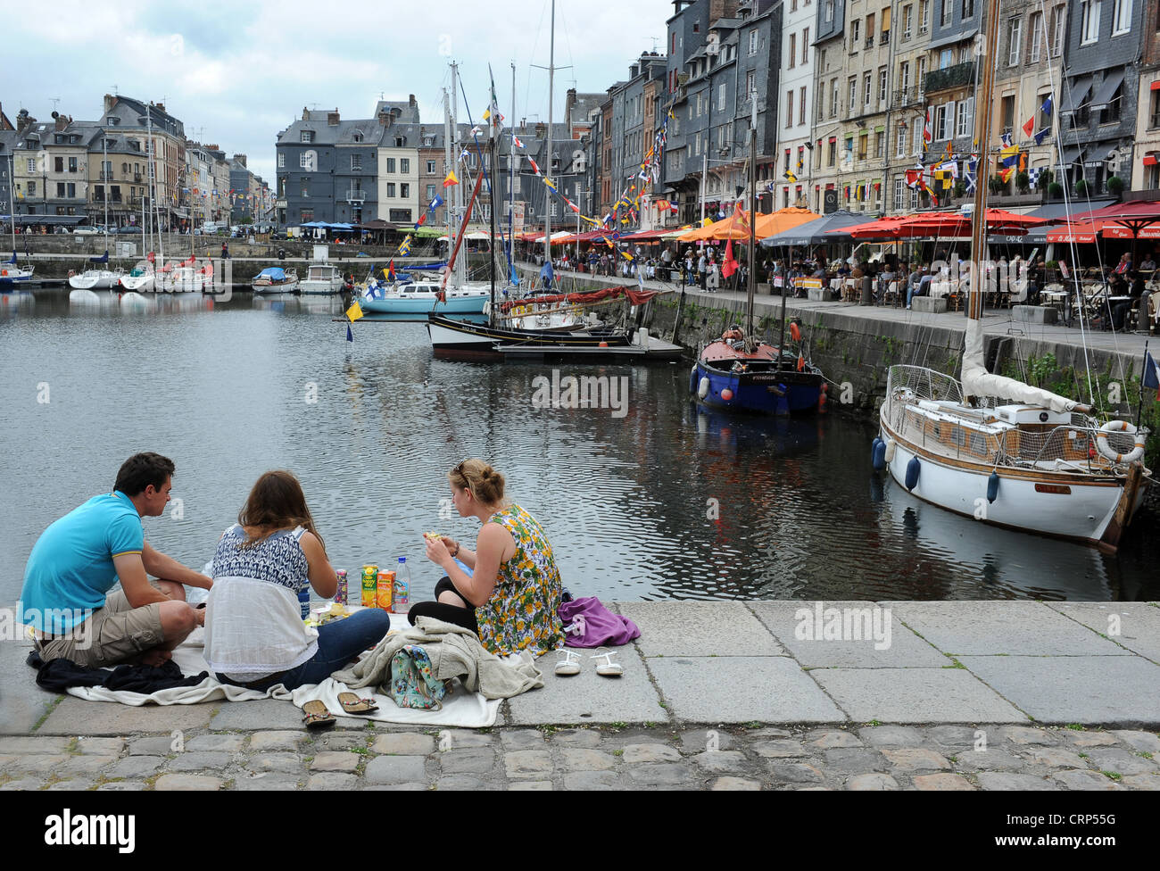 Honfleur Normandy France people having a picnic in harbour Stock Photo