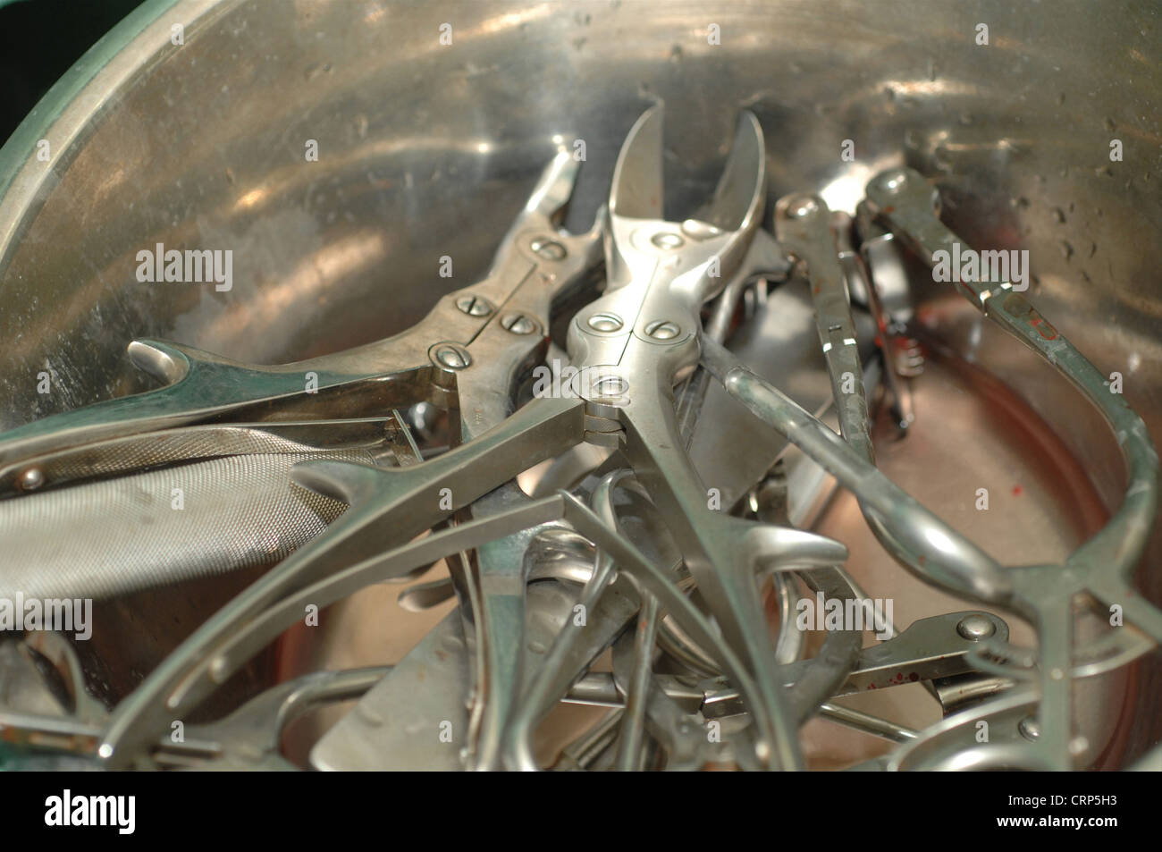 Surgical hand tools, ready to be cleaned. Stock Photo