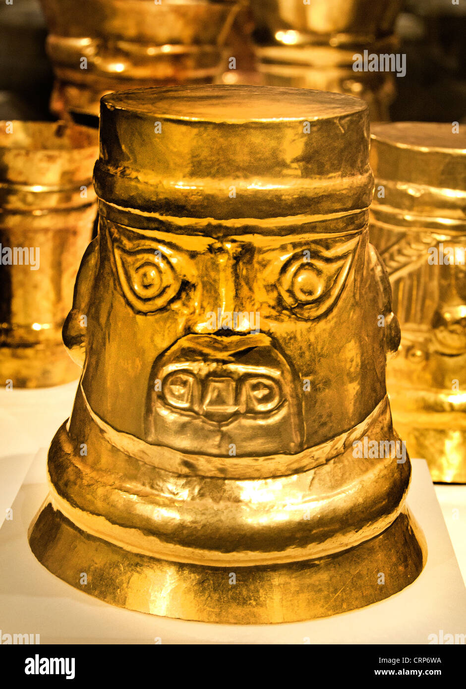 Inverse Face Beaker  9th–11th century Peru La Leche River Sicán Lambayeque Gold Stock Photo