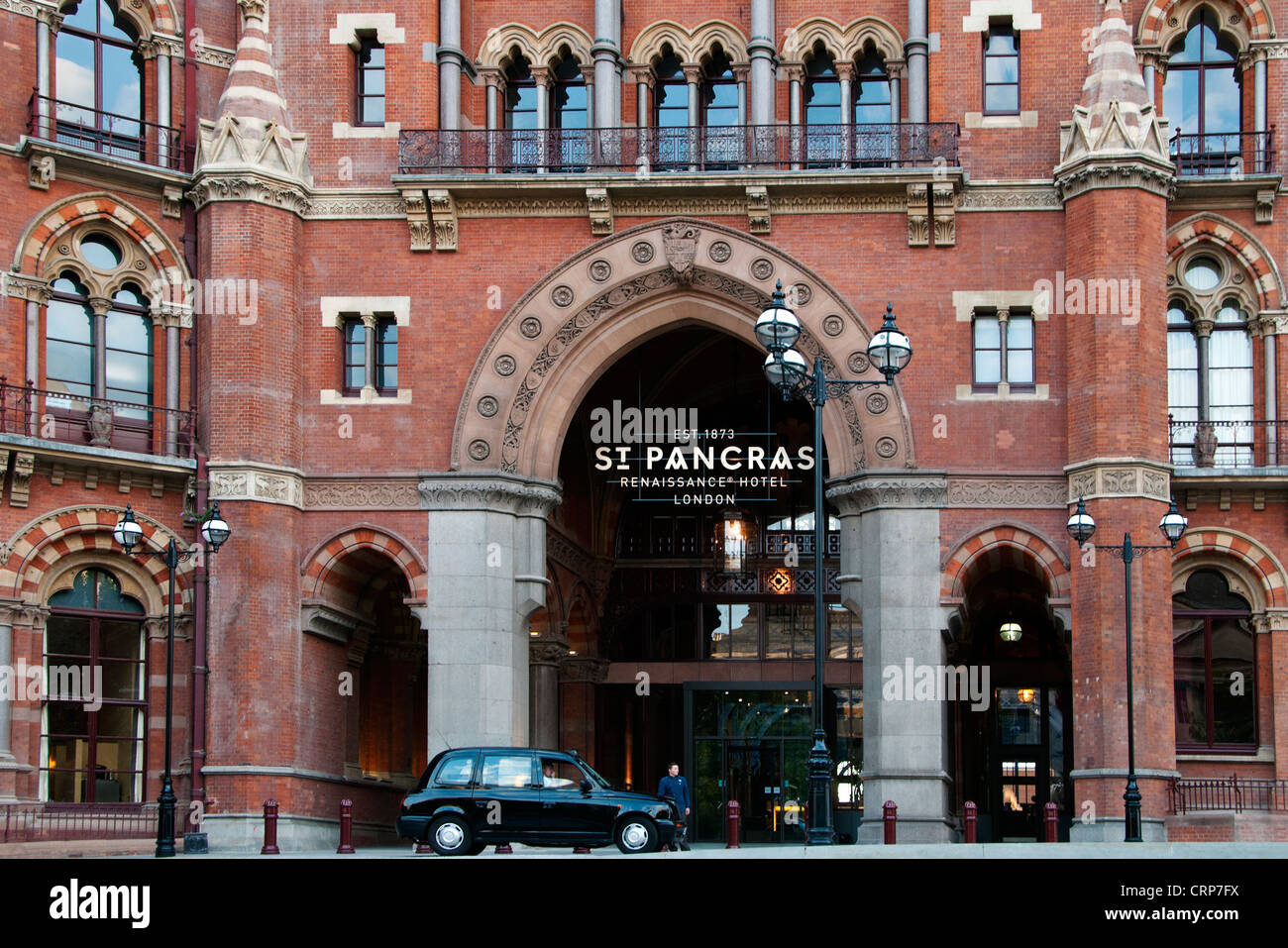 A black taxi cab waiting outside St Pancras Renaissance Hotel. Stock Photo