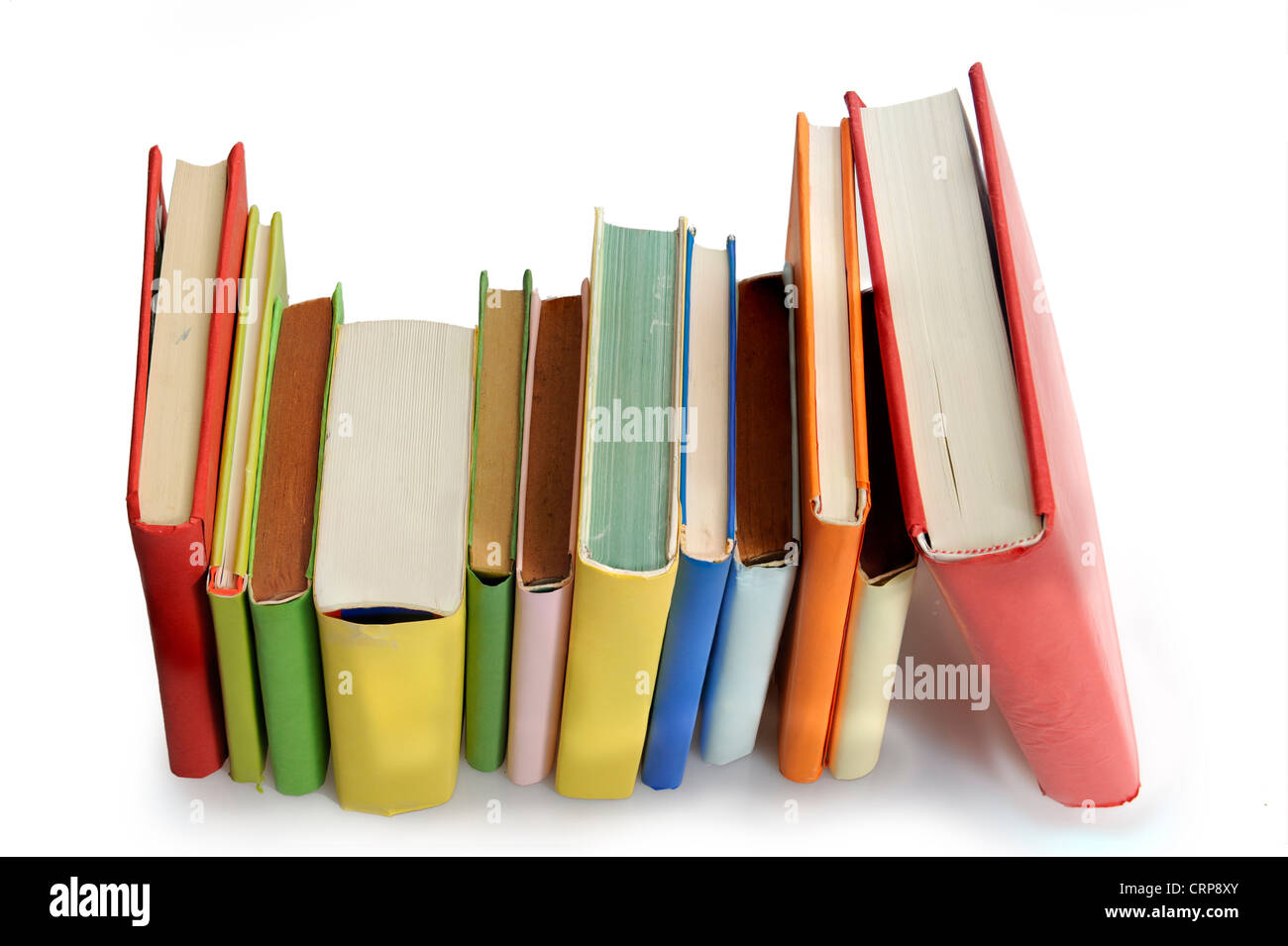 books in a row. Isolated on white background Stock Photo - Alamy