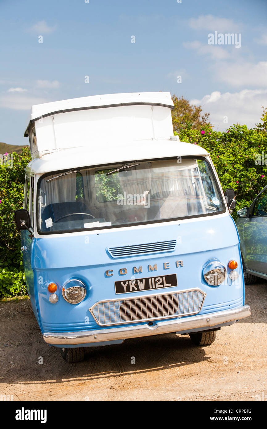 An old vintage Commer camper van in Lulworth on the Dorset coast Stock