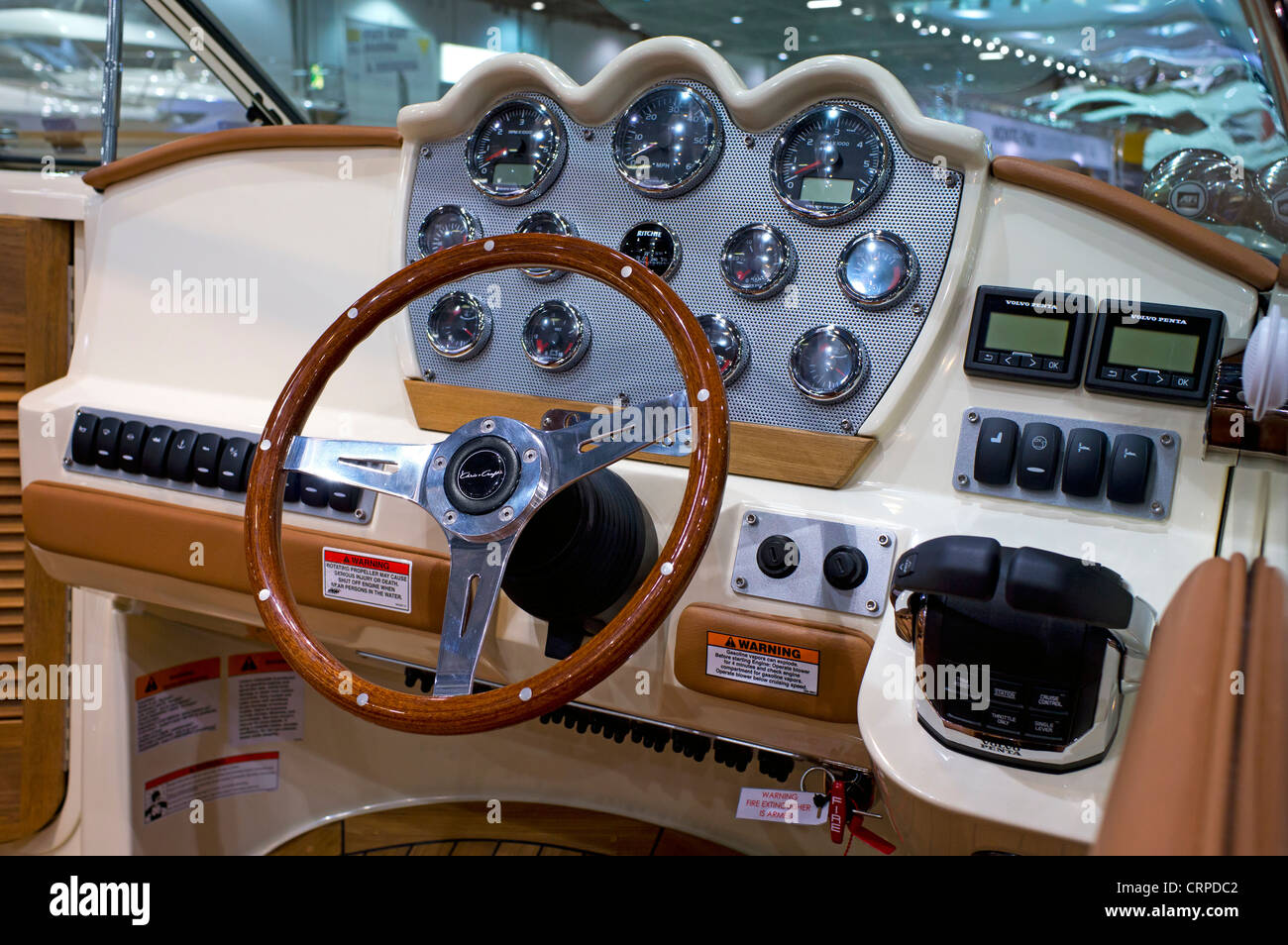 Controls and steering wheel of a motor boat on show at the London Boat Show 2012. Stock Photo