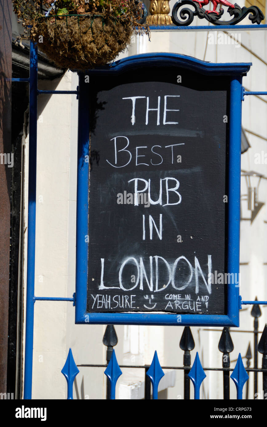 Sarcastic comments on a sign outside a pub in Kings Cross proclaiming 'The Best Pub in London'. Stock Photo