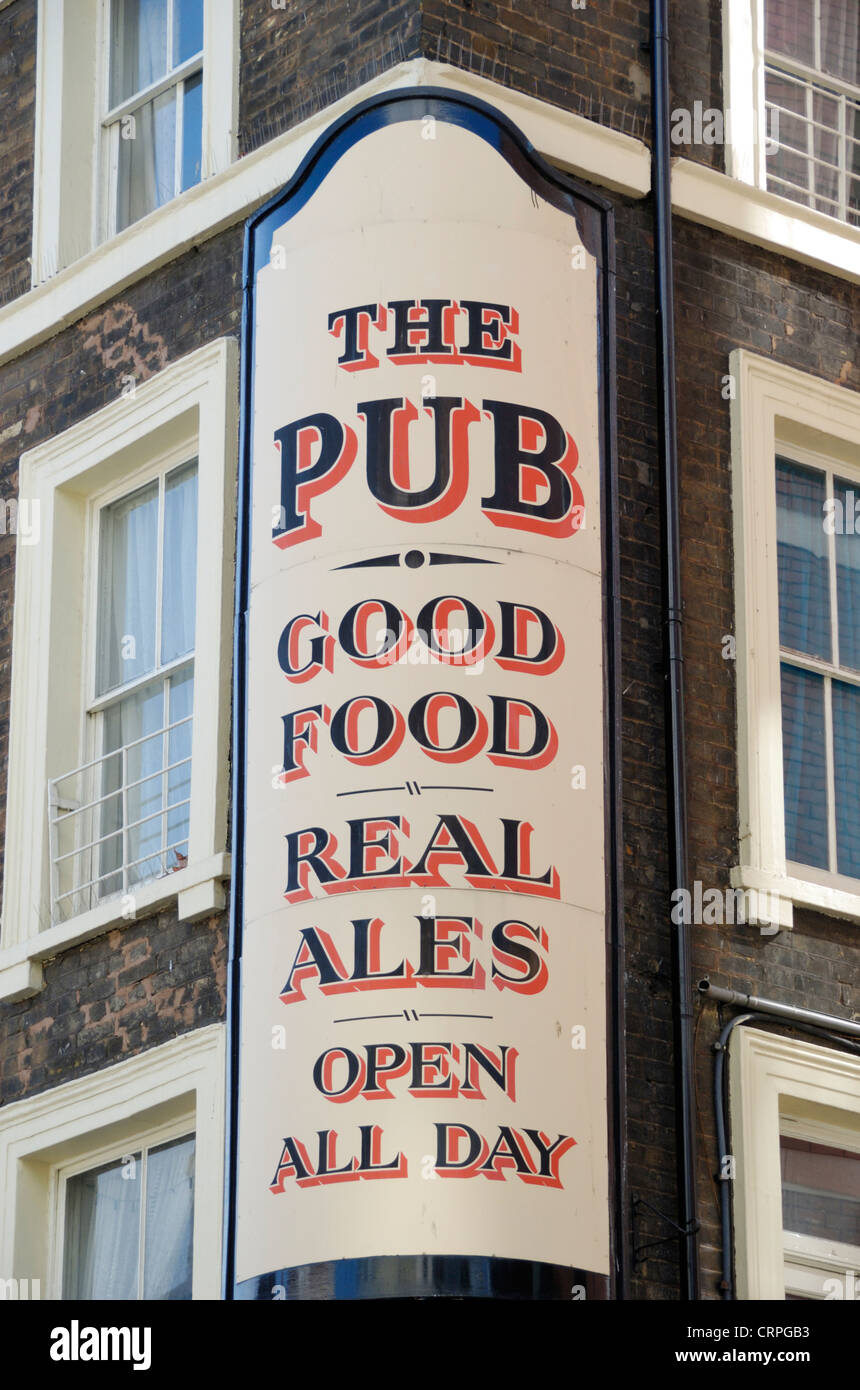 'The Pub' sign outside a public house advertising Good Food, Real Ales, Open All Day. Stock Photo