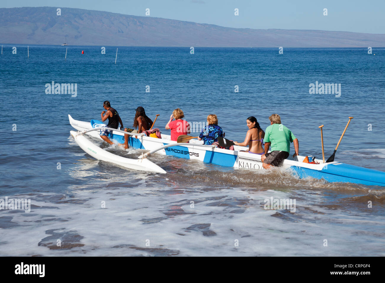 Paddlers embark on outrigger canoe tour in West Maui Stock Photo Alamy