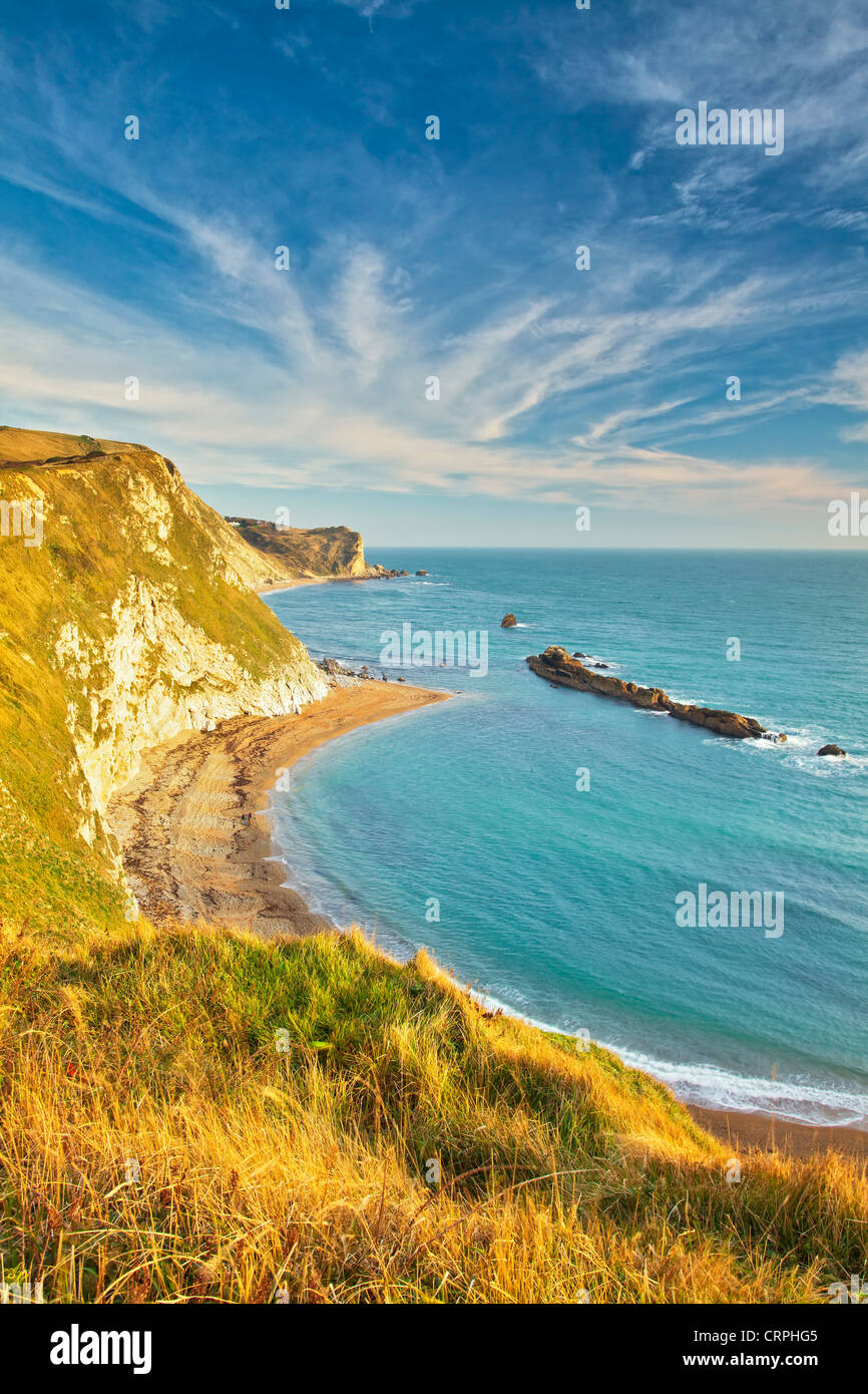 View from the chalk cliffs above Man O'War Cove of St Oswald's bay on the Jurassic Coast. Stock Photo