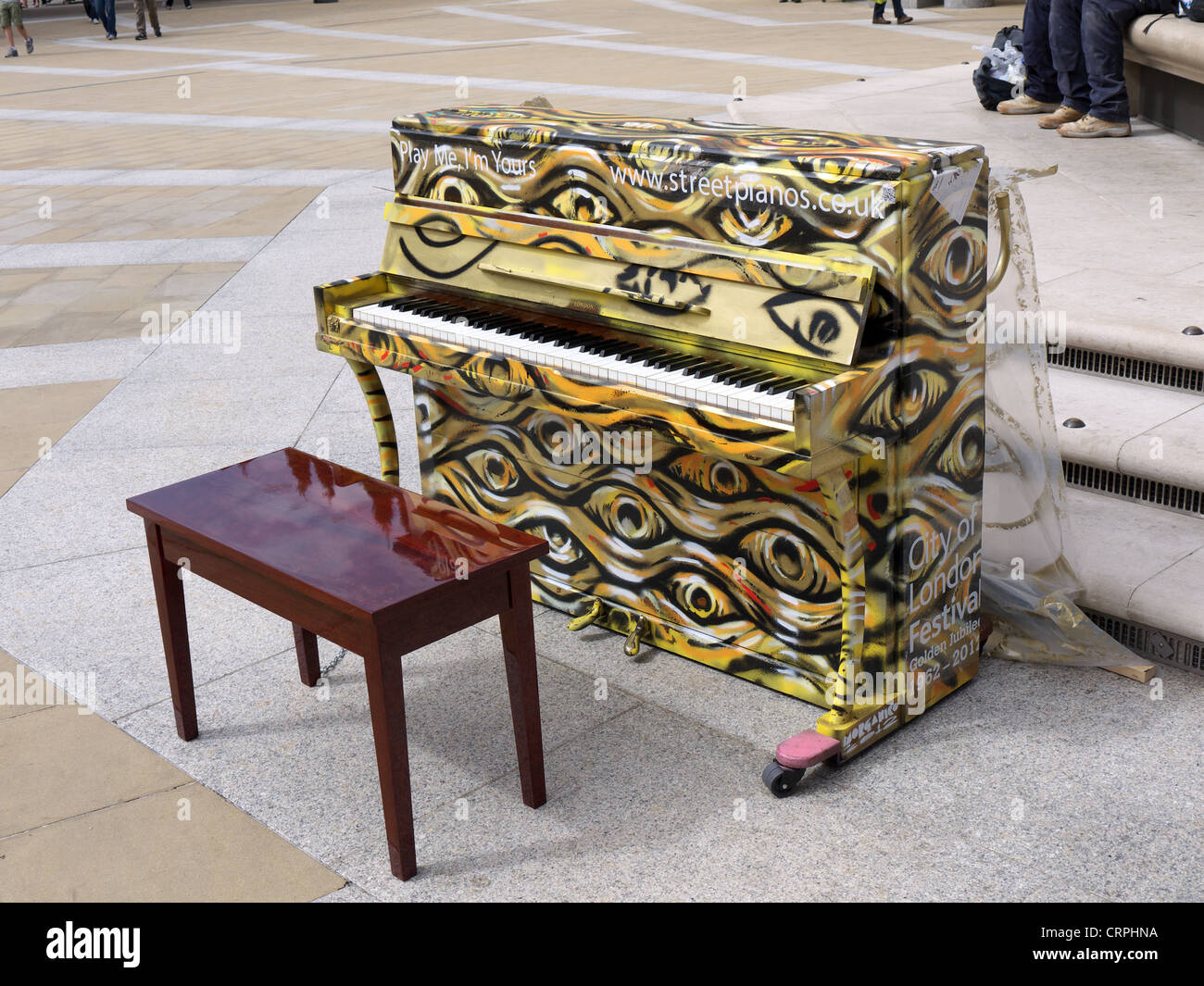 A streetpiano waiting to be played by a member of the public in London Stock Photo