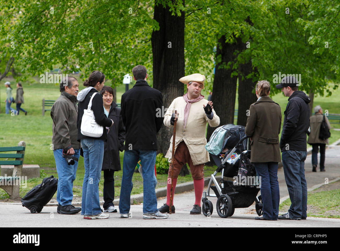 Colonial era reenactor leads a tour group on Boston Common, Boston, Massachusetts Stock Photo