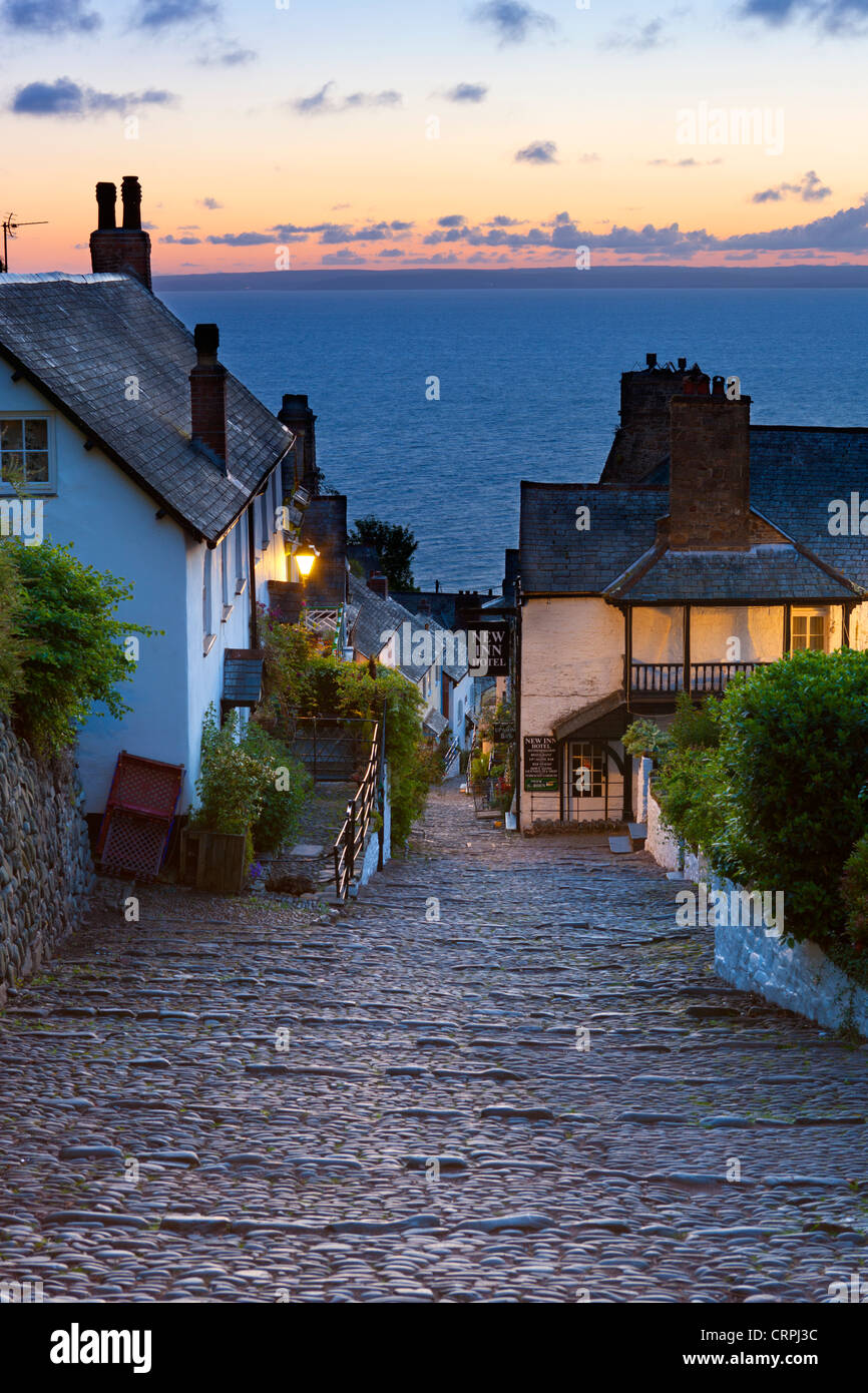 Steep narrow cobbled street leading down to the world famous fishing village of Clovelly. Stock Photo