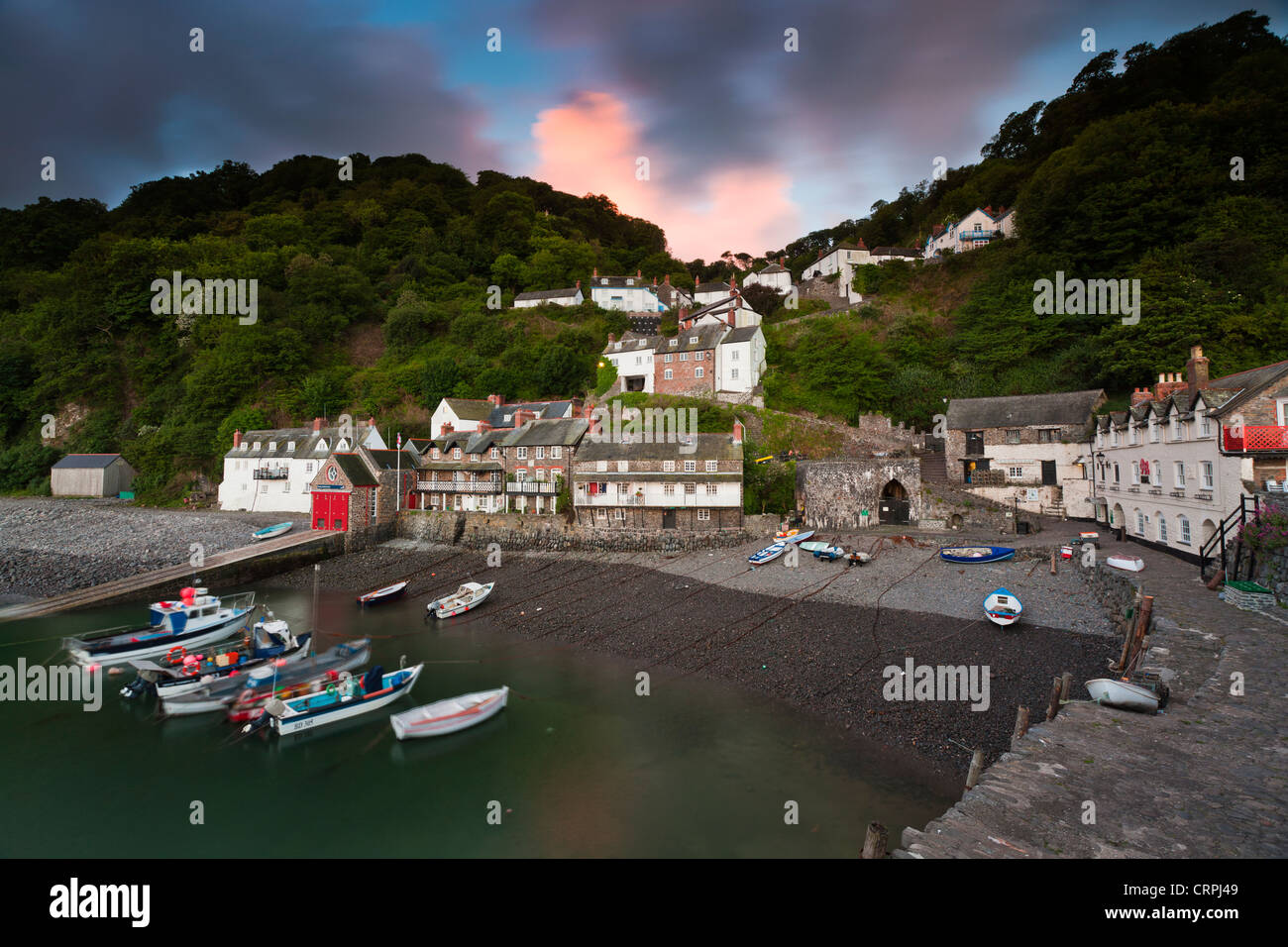 Fishing boats moored in the harbour of Clovelly, a world famous, privately owned fishing village in North Devon. Stock Photo