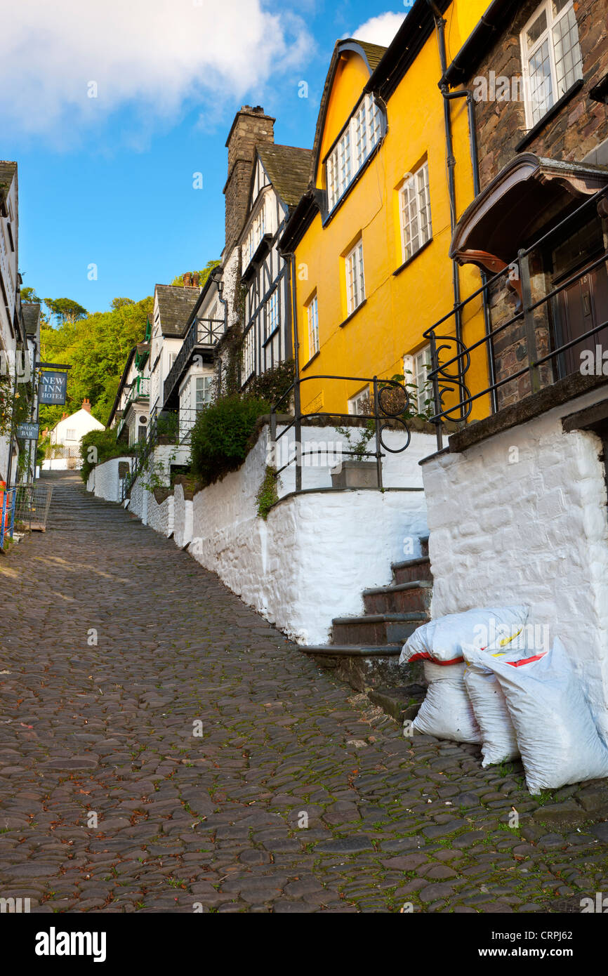 Steep narrow cobbled high street in the world famous fishing village of Clovelly. Stock Photo