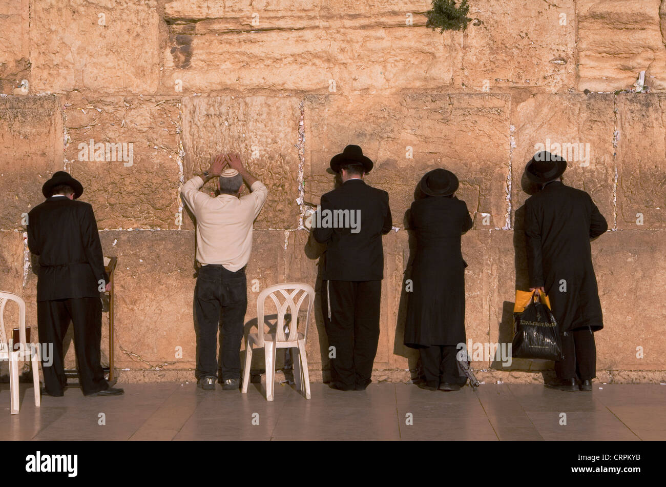 Orthodox and Hassidic Jews worship at the Old City's Western Wall, Jerusalem, Israel Stock Photo