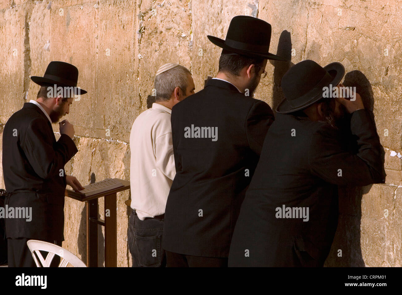 Orthodox and Hassidic Jews worship at the Old City's Western Wall, Jerusalem, Israel Stock Photo