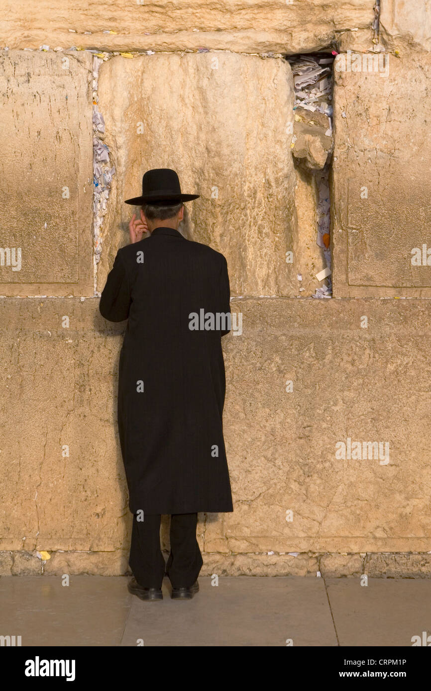 Orthodox Jew worships at the Old City's Western Wall, Jerusalem, Israel Stock Photo