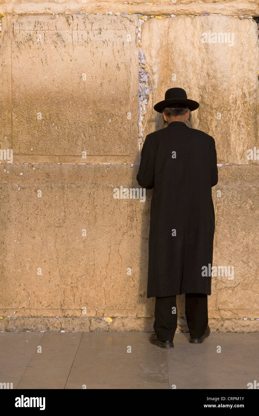 Orthodox Jew worships at the Old City's Western Wall, Jerusalem, Israel Stock Photo