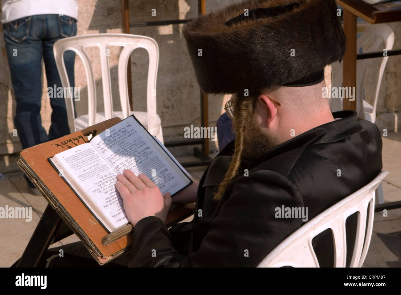 Hassidic Jew reads the Torah at the Old City's Western Wall, Jerusalem, Israel Stock Photo