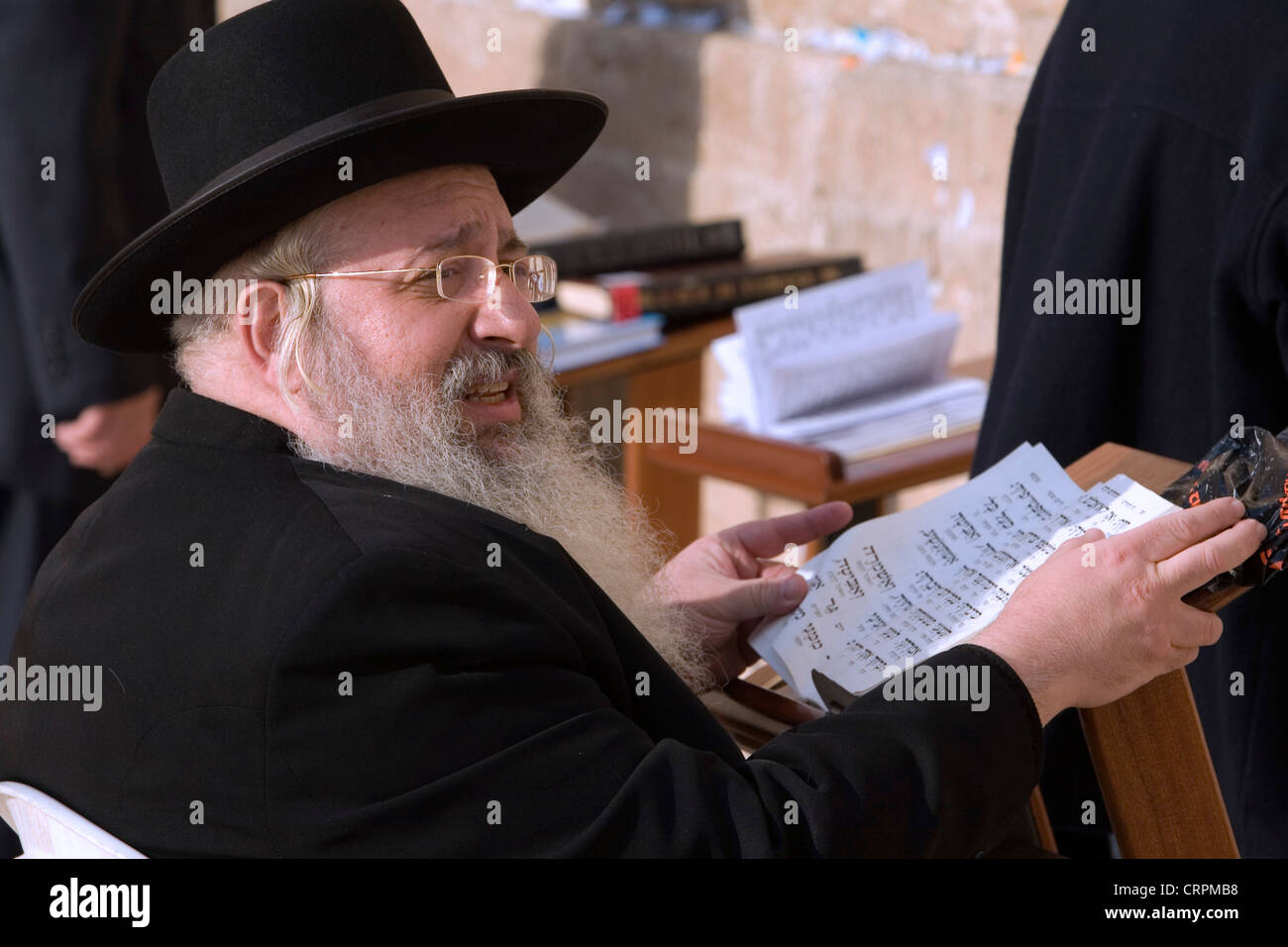 Orthodox Jew reads the Torah at the Old City's Western Wall, Jerusalem, Israel Stock Photo