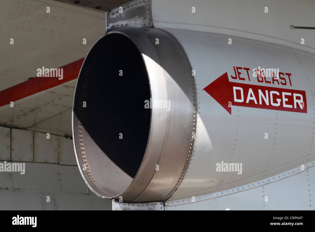 A closeup of the engine exhaust with warning sign on an old US Navy