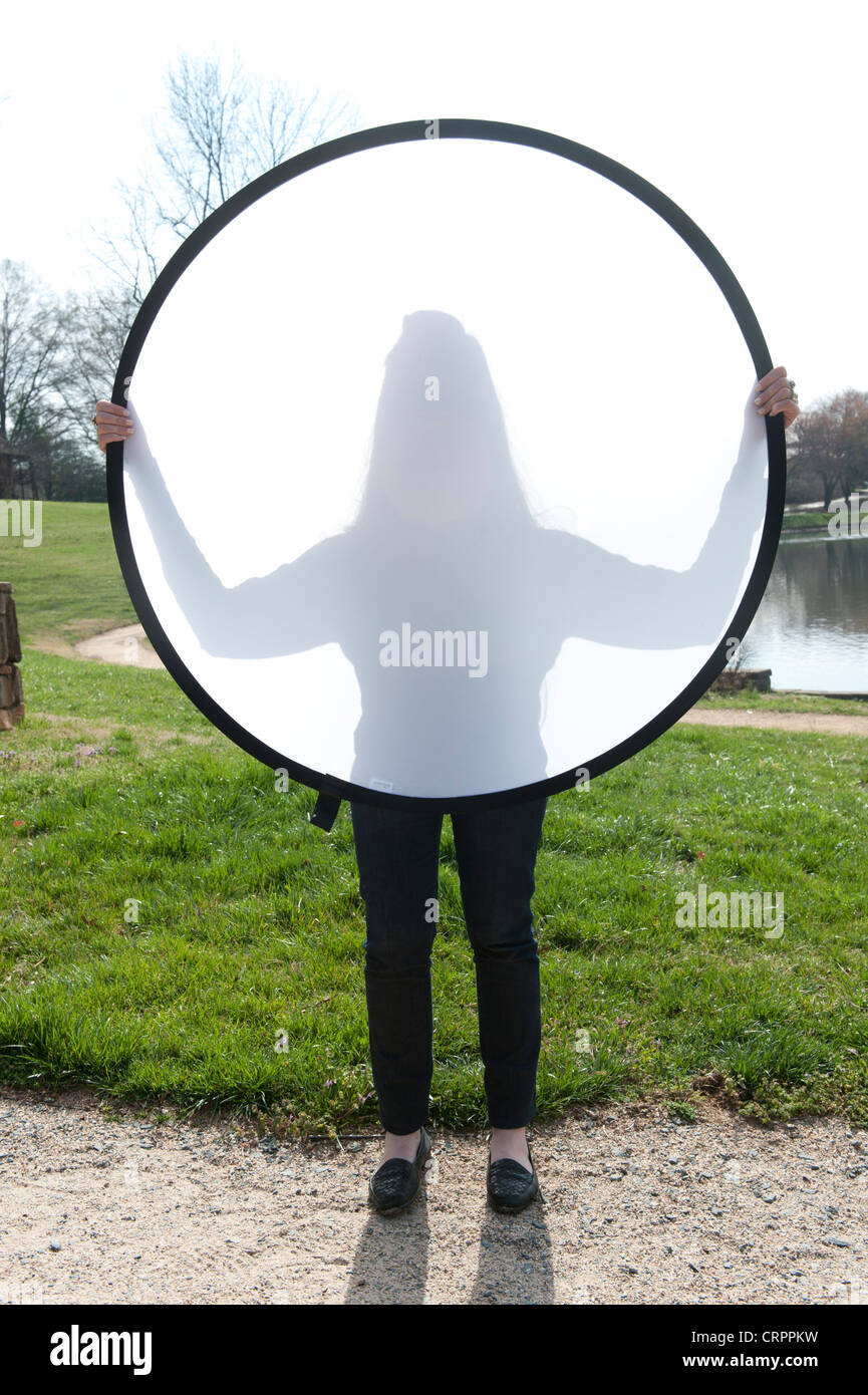 Woman behind diffusion panel Stock Photo