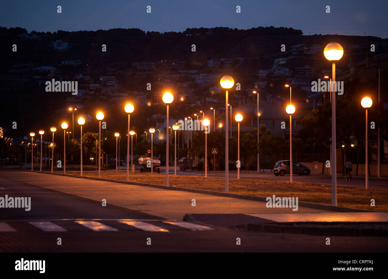 Parallel rows of street lights in an urbanization, Javea, Spain Stock