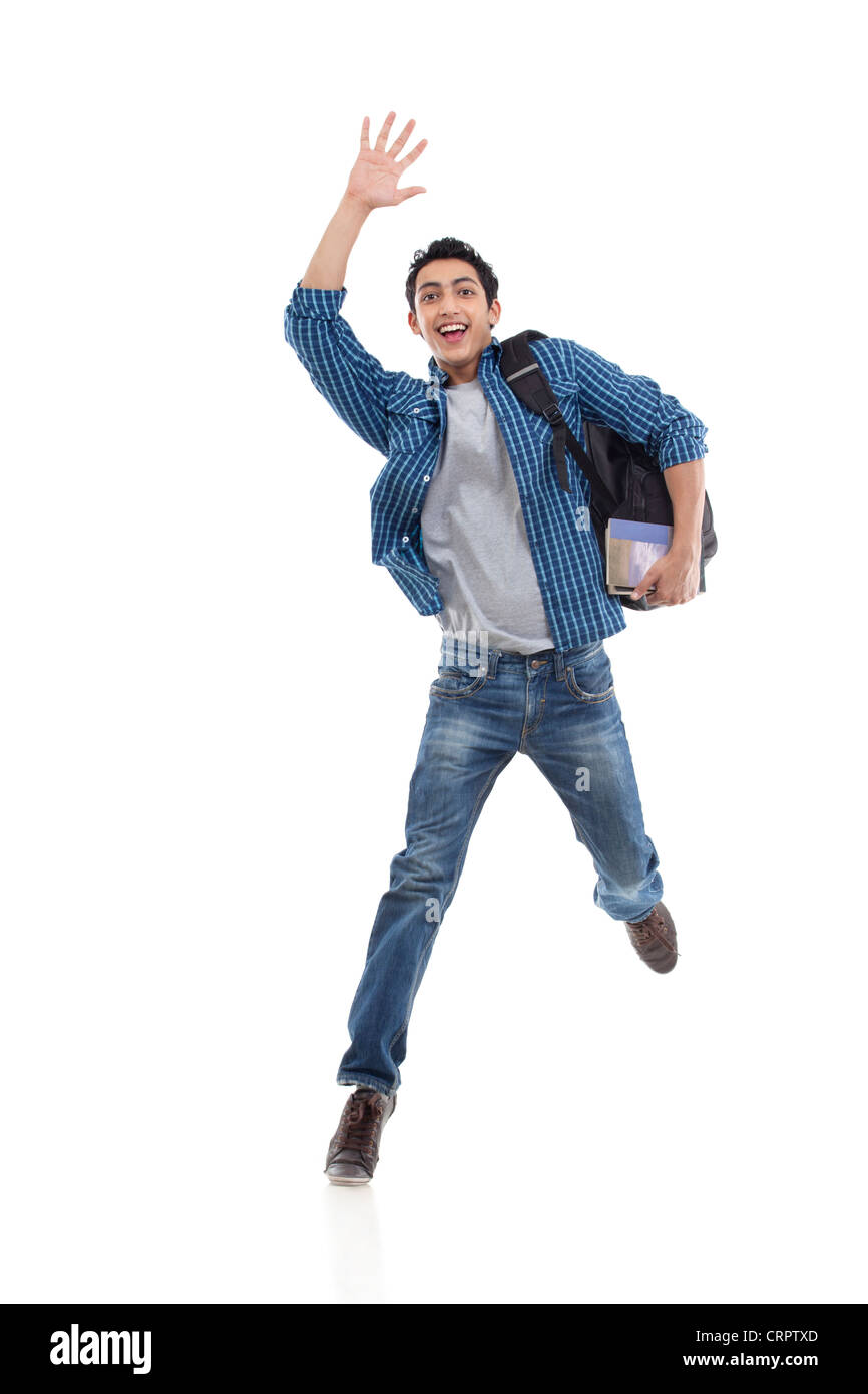 Excited young college student waving over white background Stock Photo
