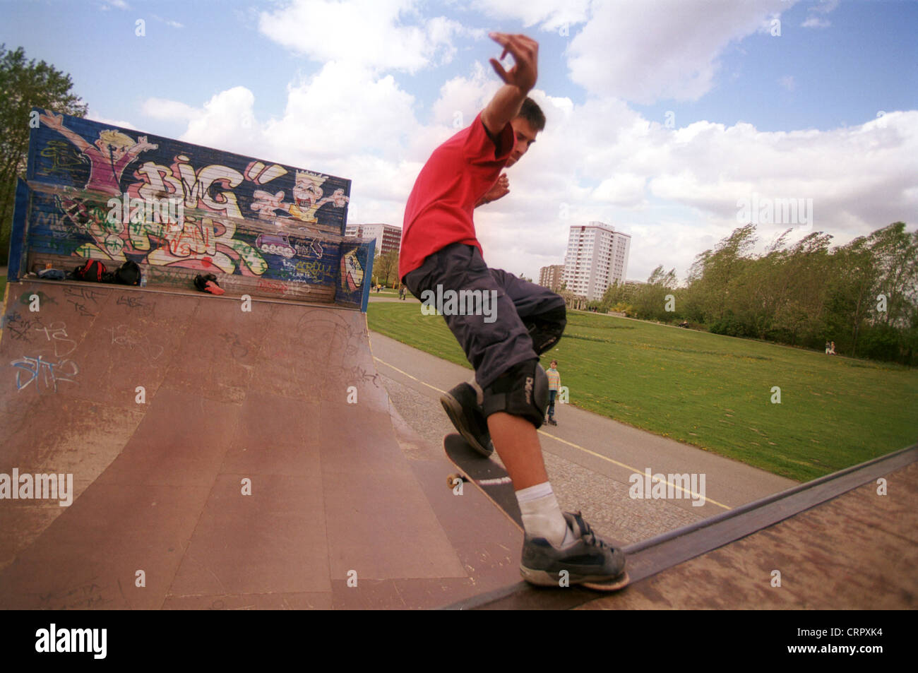 Skater rides his skateboard on a halfpipe Stock Photo Alamy