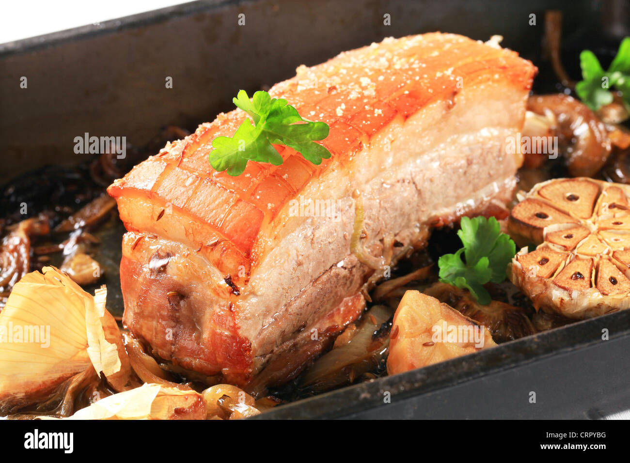 Roast pork belly with garlic and onion Stock Photo Alamy