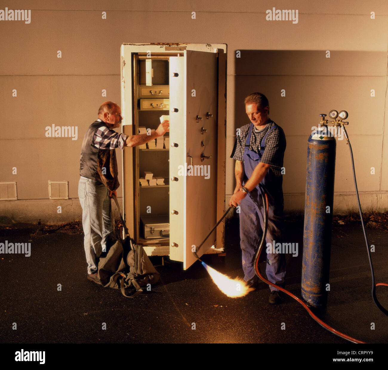 Two burglars break into a vault Stock Photo Alamy