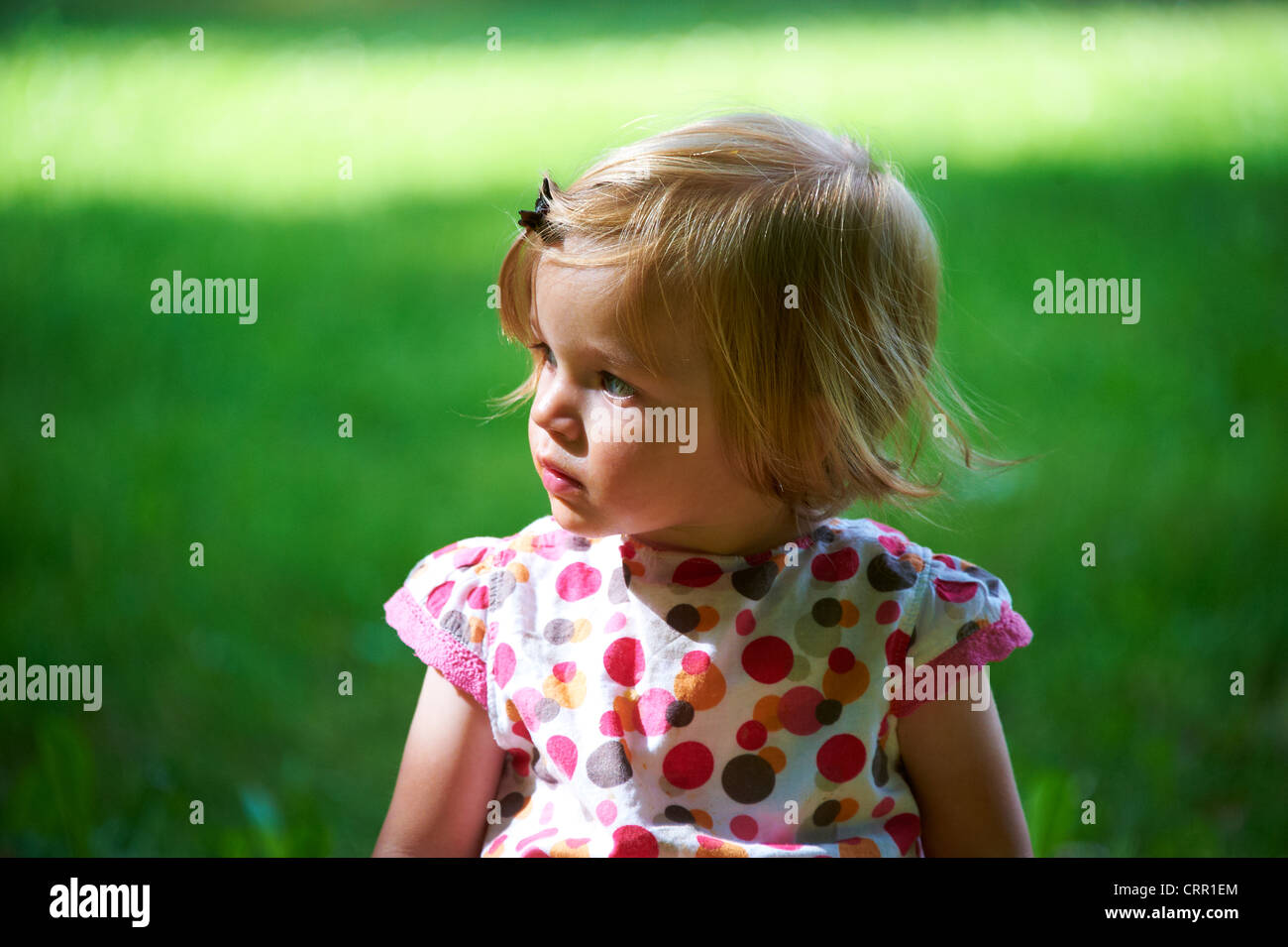 Portrait of child blond baby girl in summer park Stock Photo - Alamy