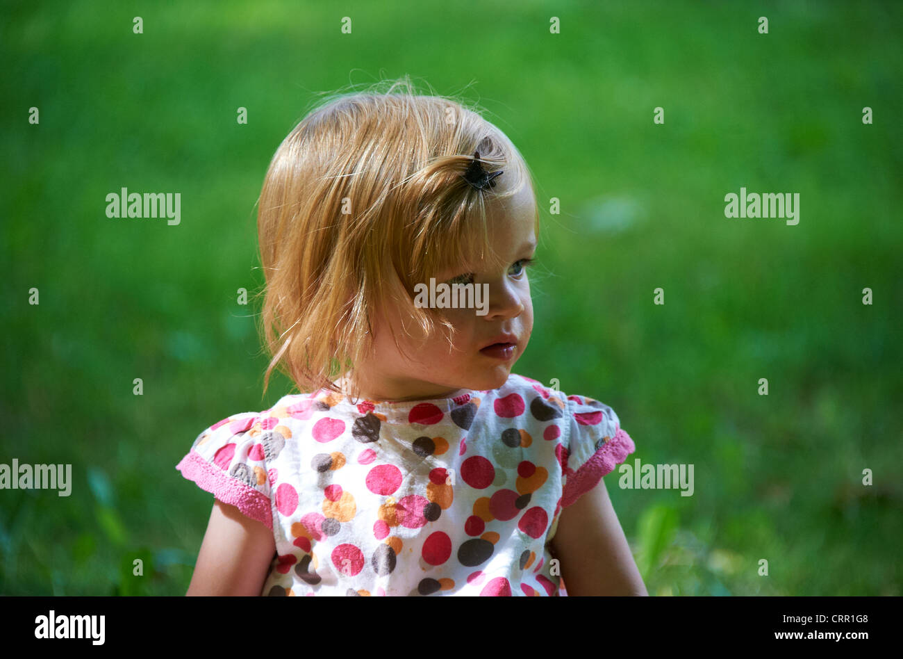 Portrait of child blond baby girl in summer park Stock Photo - Alamy