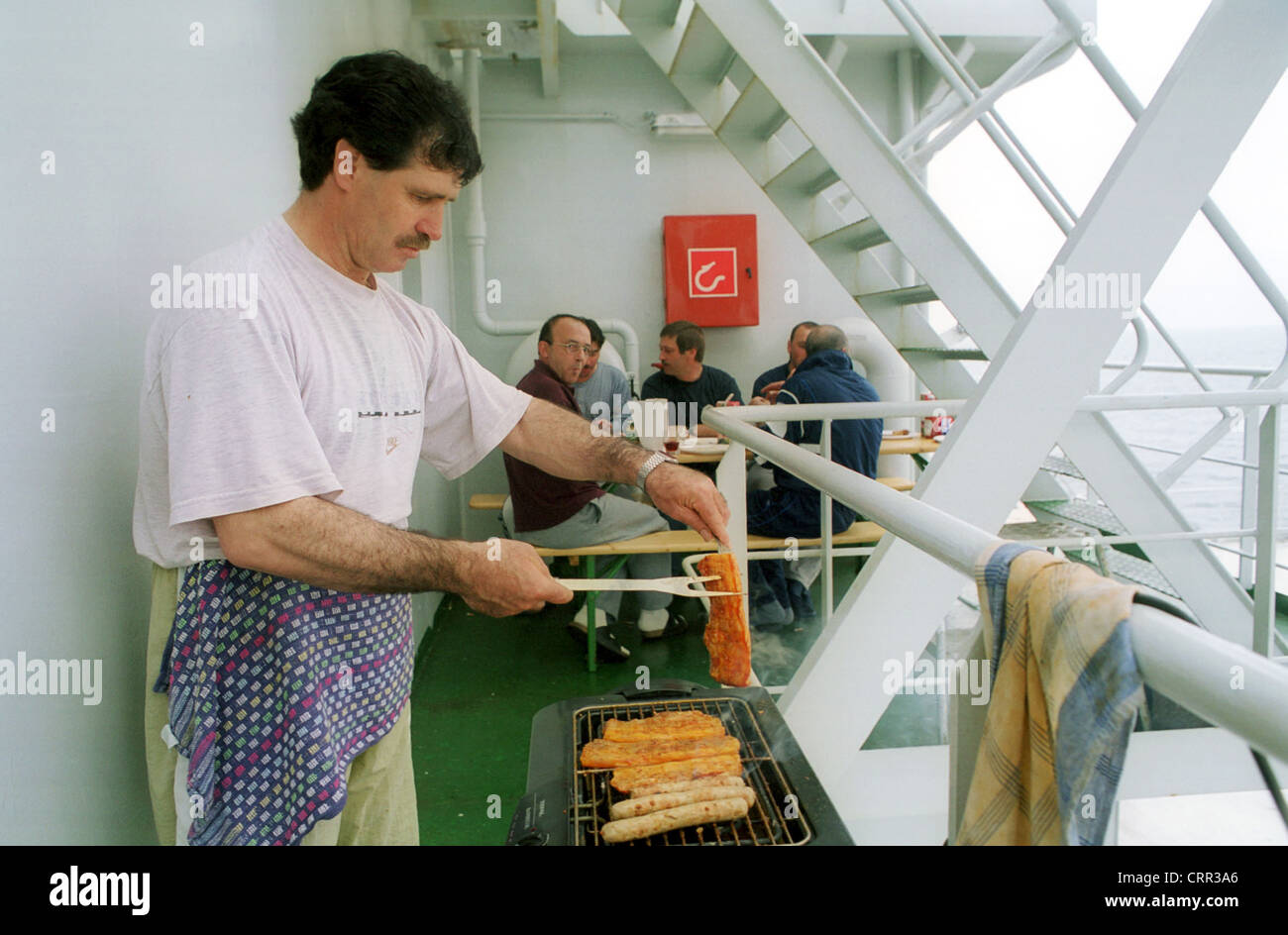 Sailor grilling meat for the crew (Baltic Stock Photo - Alamy