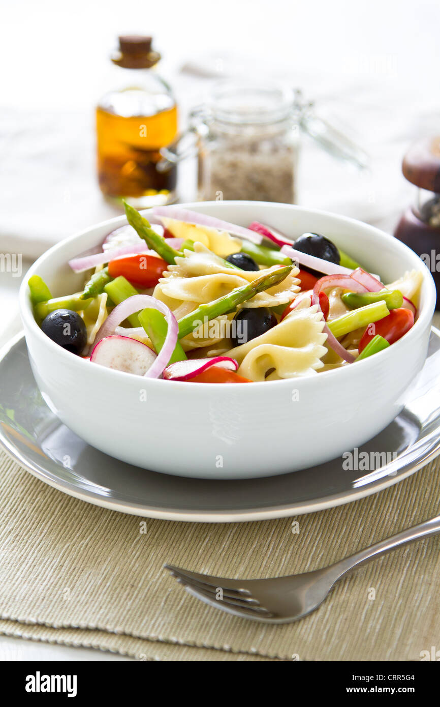 Pasta with asparagus and olive salad Stock Photo