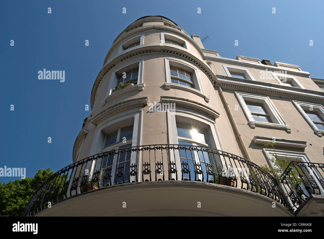 rounded corner building with balcony and sunburst in window on royal crescent, holland park, london, england Stock Photo