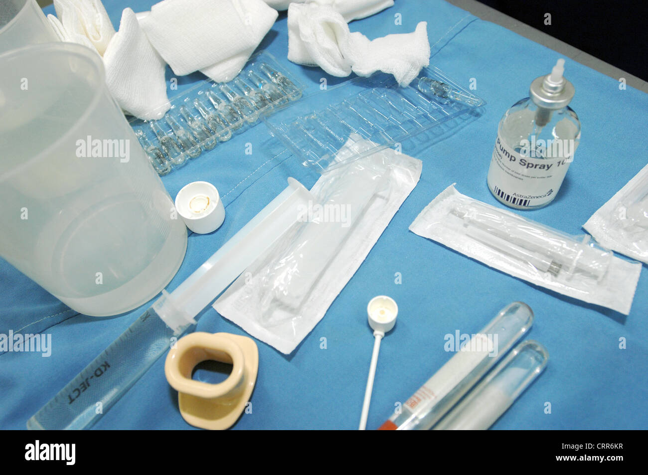 Various equipment used during endoscopic treatment, including; syringes, mouth 'gag' and ampoules of injectable analgesia. Stock Photo
