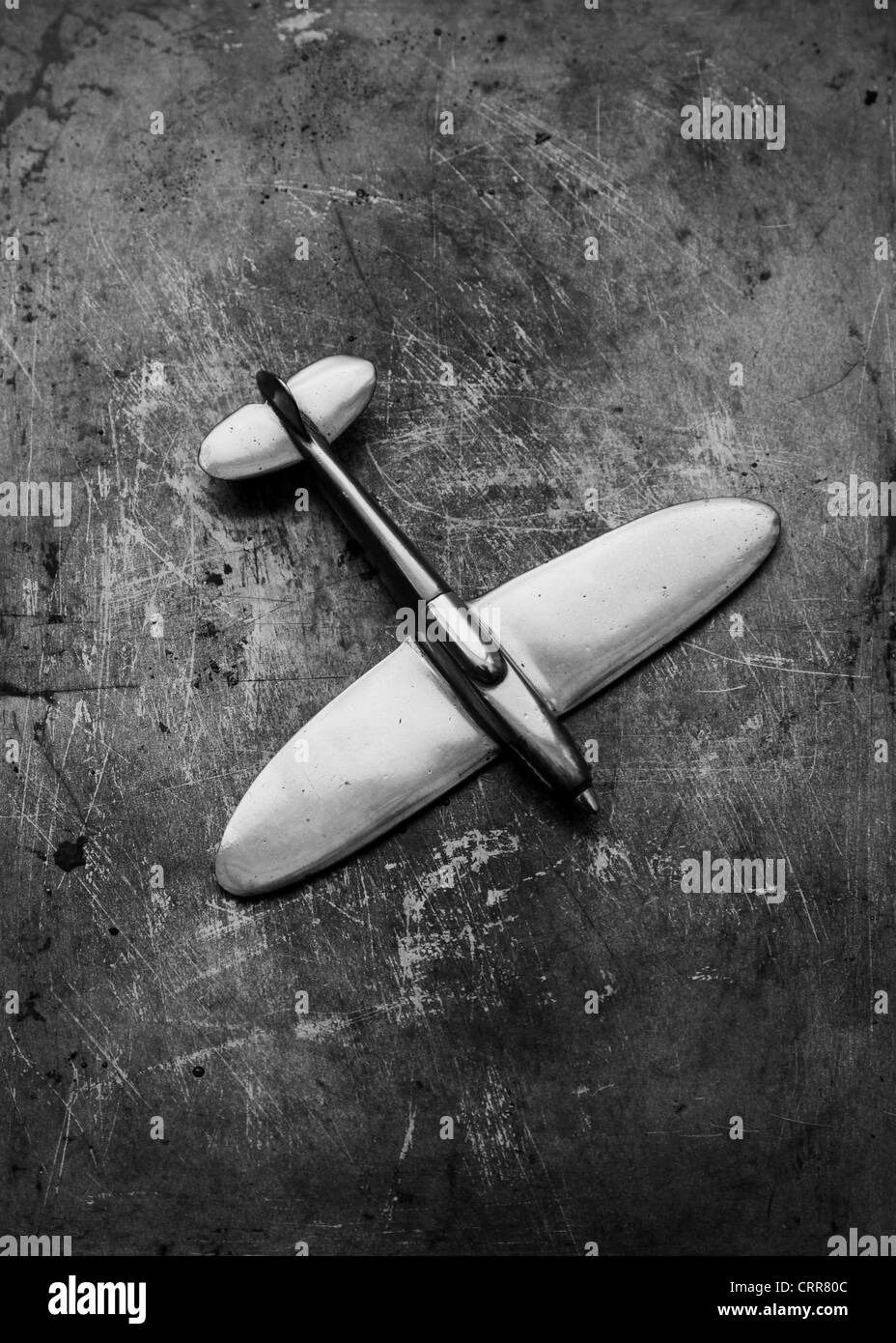 WW2 model spitfire on distressed metal background Stock Photo