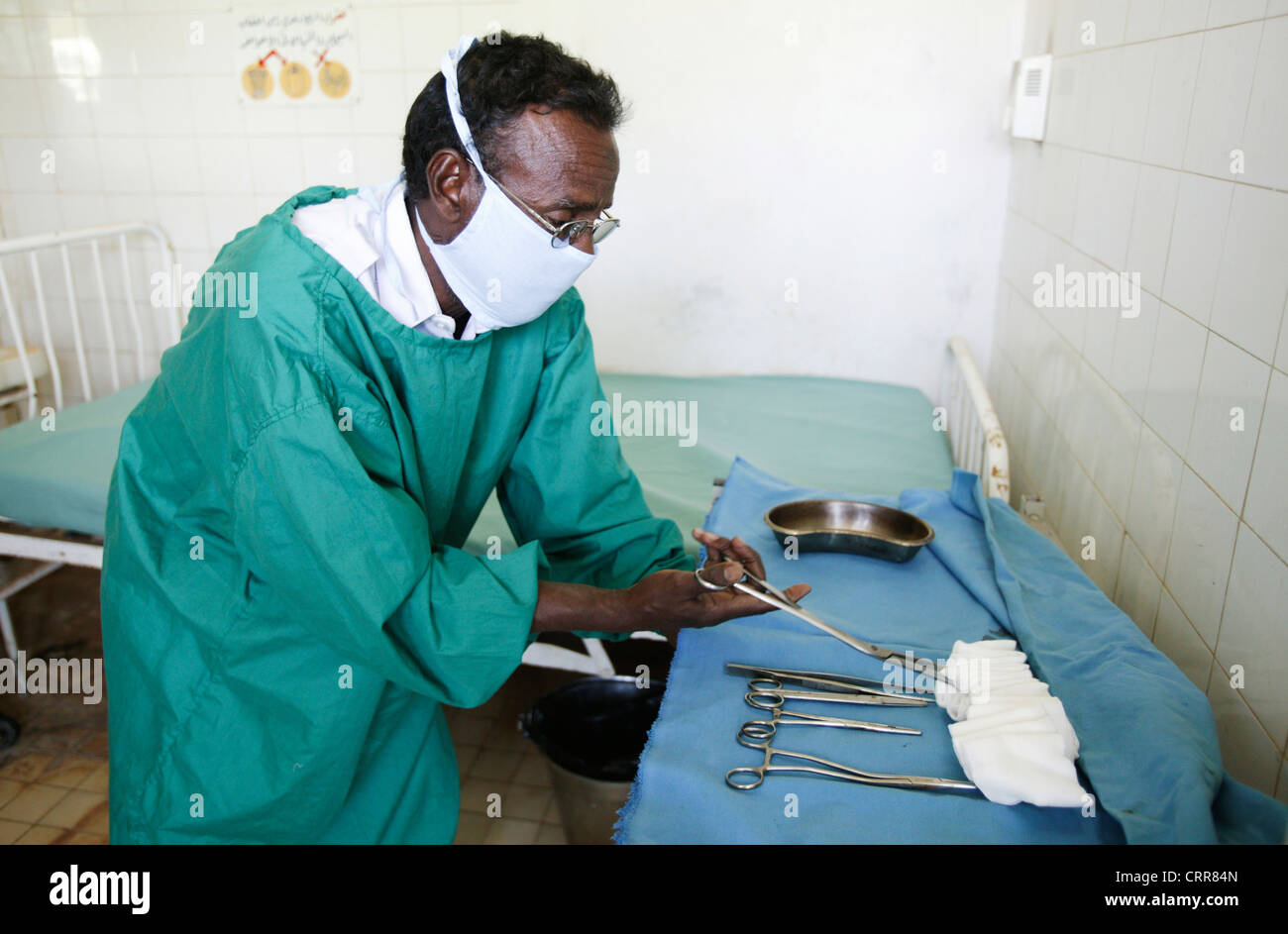 Medical staff lay out sterilized medical equipment in a hospital ward. Stock Photo