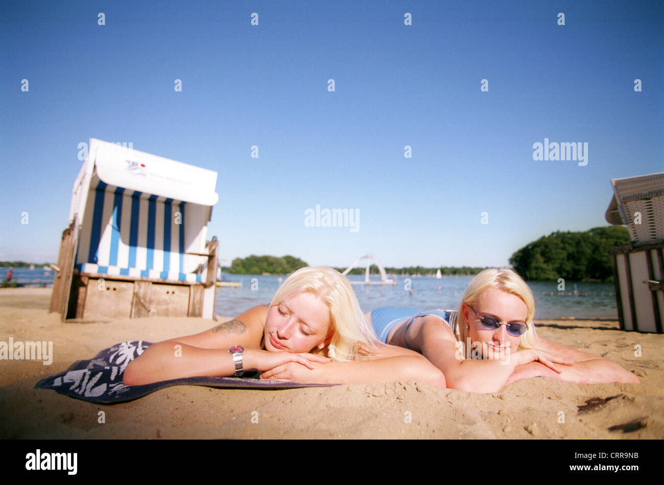 Women sun themselves in a bathing Berlin Stock Photo