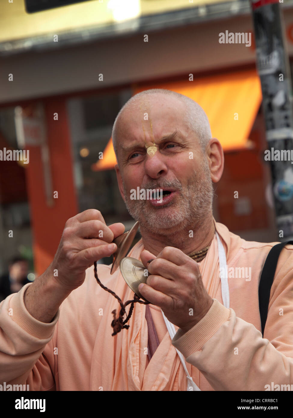 Hare Krishna devotee in the streets of Curitiba downtown Stock Photo - Alamy