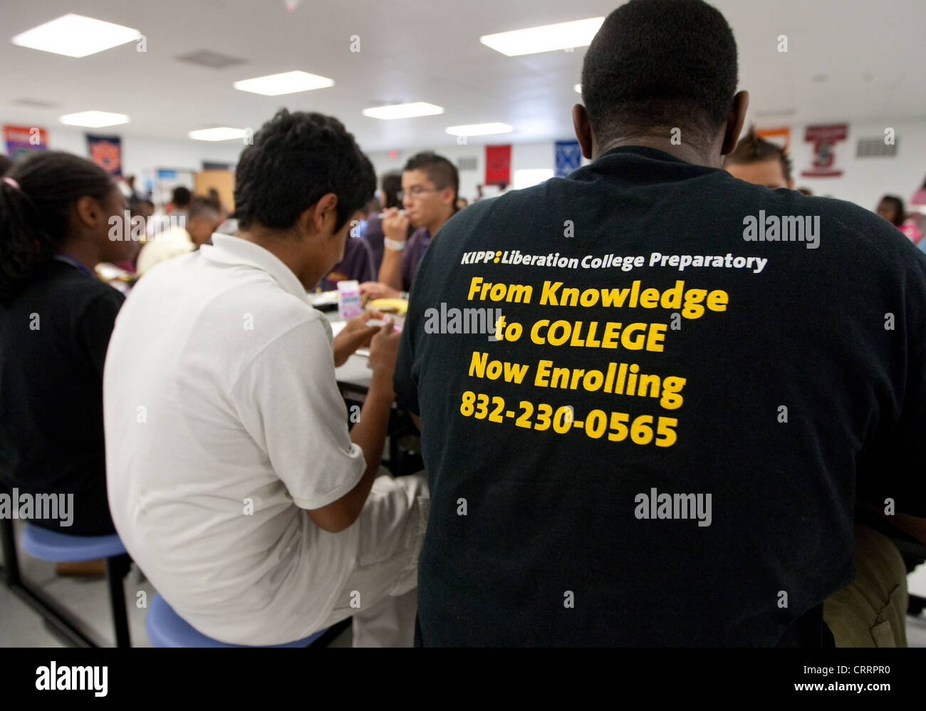 Students at public charter high school in Houston wear t-shirts with positive messages and wears spiky hair mohawk Stock Photo