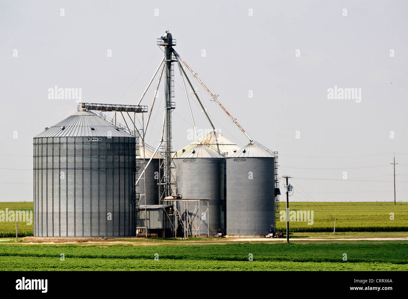 A grain silo sits in the empty plains of Texas Stock Photo